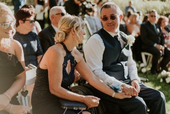 Steven sits after his proudest moment of walking his daughter down the aisle