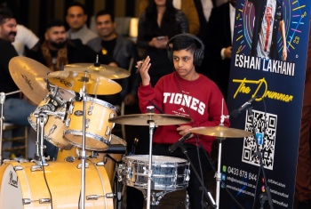 Eshan Lakhani playing the drums live