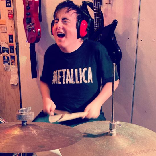 Ky playing the drums