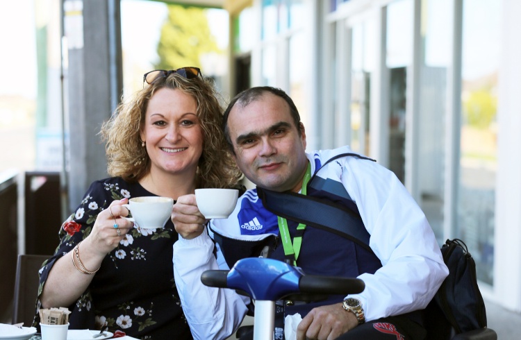 Julie and Tony enjoy a coffee together at a cafe