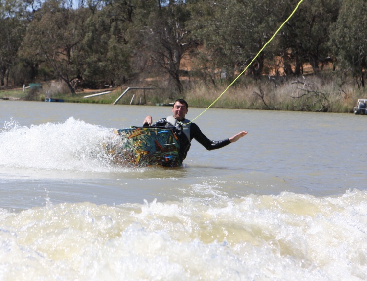 Stefan creating waves on his wakeboard