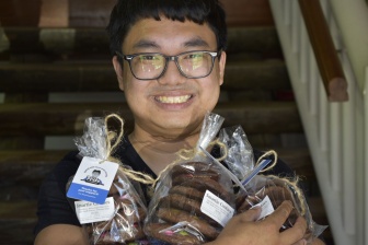 Fritz Maloping with bags of cookies