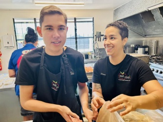 Flynn and Diana in the kitchen at Eat Real