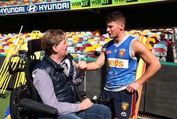 John talks with Brisbane Lions AFL player