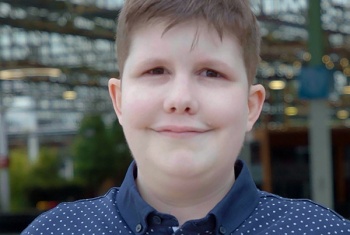 A close up of Brett who is smiling at the camera
