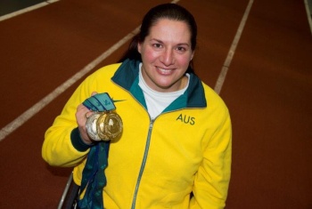Louise holding her medals