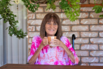 Gill Godfrey sipping a cup of tea