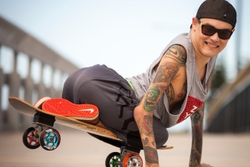 MC wheels showing of his skateboard skills.