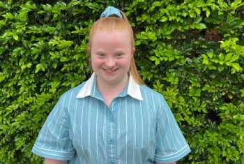 Alyssa Cotterill in school uniform in the garden