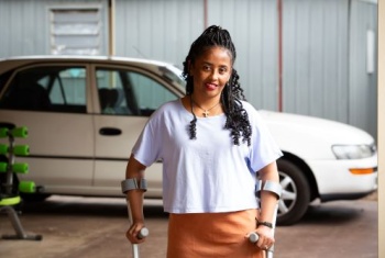 Yodit Yeabiyo standing in a white shirt