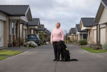 Linda Blaik outside with her assistance dog